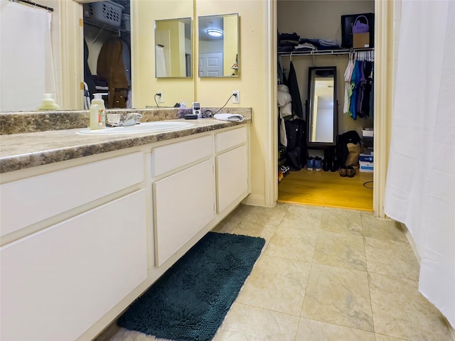 bathroom featuring hardwood / wood-style flooring and vanity