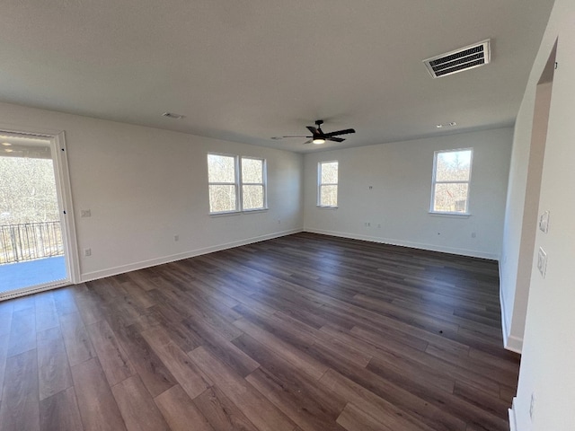 unfurnished room featuring dark hardwood / wood-style floors and ceiling fan