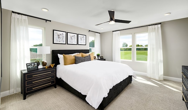 carpeted bedroom featuring ceiling fan