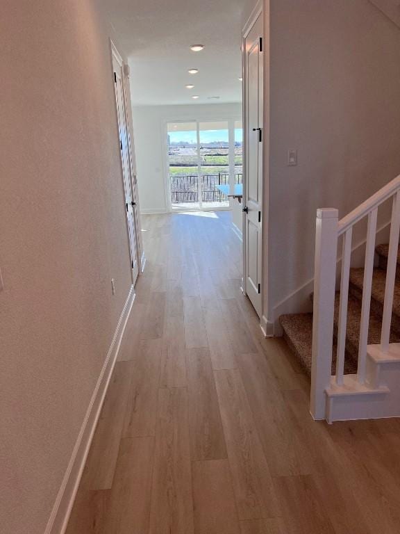 hallway featuring light wood-type flooring