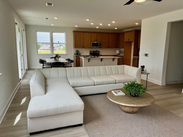 17108 Vernal Rd, Manor, TX 78653 - living area with light wood-type flooring, ceiling fan, and recessed lighting