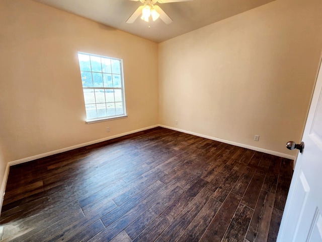 empty room featuring ceiling fan and dark hardwood / wood-style floors