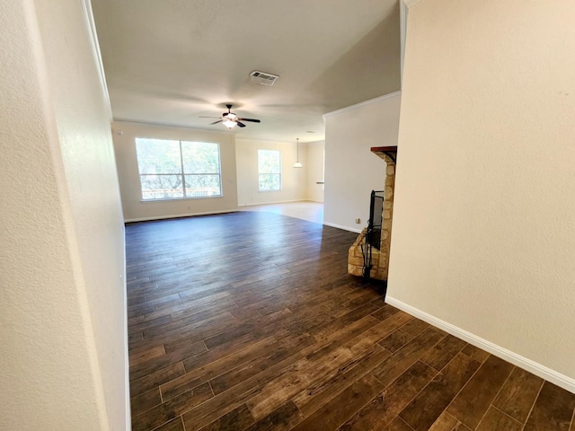 unfurnished living room with dark wood-type flooring and ceiling fan