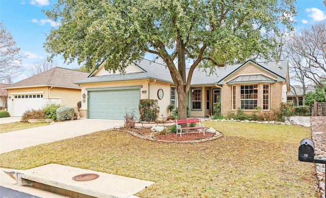 view of front of house with a garage and a front lawn