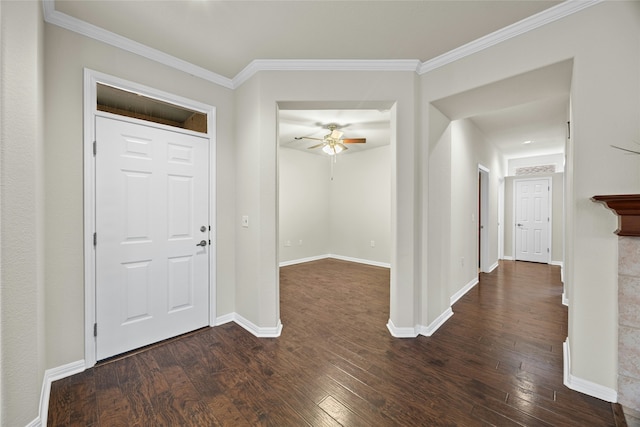 entryway with ceiling fan, dark hardwood / wood-style flooring, and ornamental molding