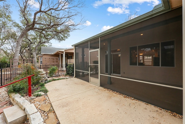 view of patio / terrace with a sunroom