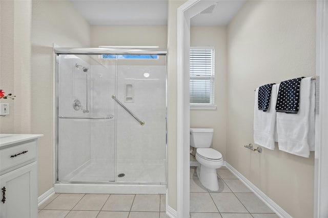 bathroom with toilet, a shower with door, vanity, and tile patterned flooring