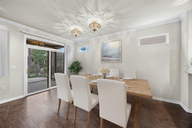 dining area featuring dark wood-type flooring, crown molding, and a notable chandelier