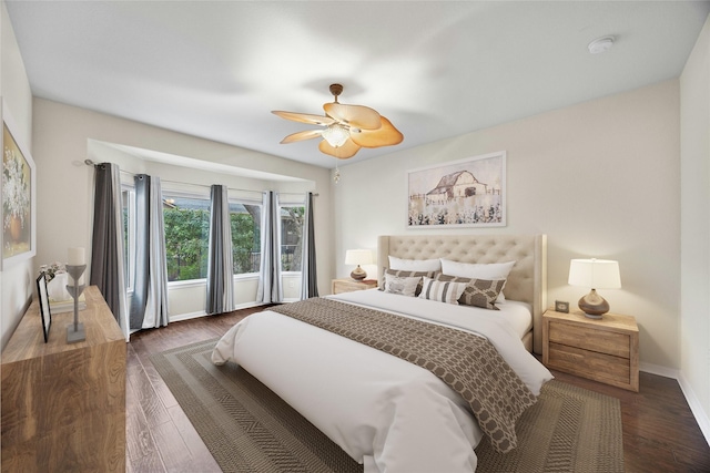 bedroom featuring dark wood-type flooring and ceiling fan