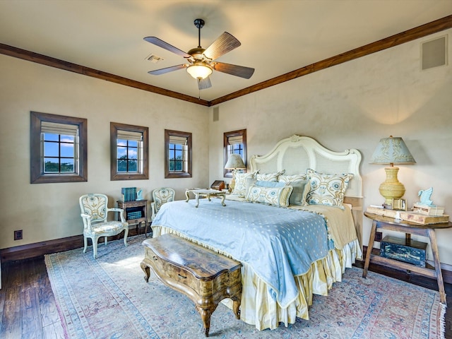 bedroom featuring ceiling fan, crown molding, and wood-type flooring