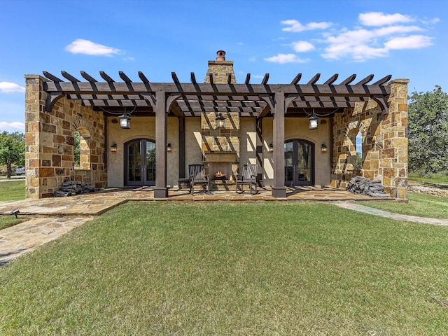 back of property with a lawn, french doors, and a pergola