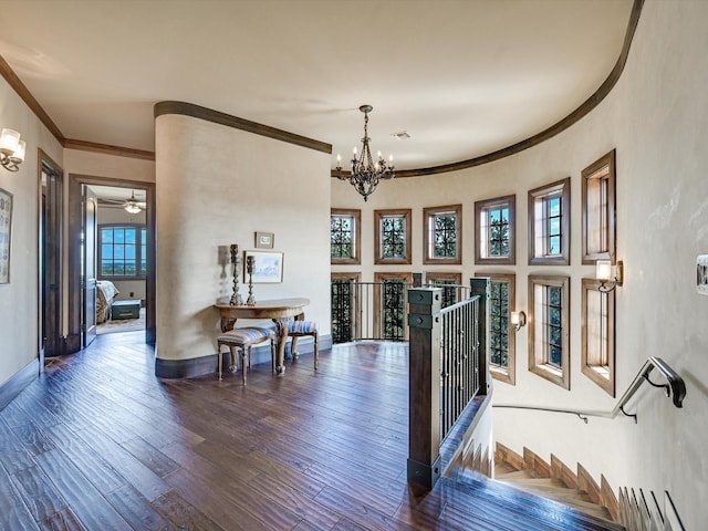 interior space featuring dark wood-type flooring and a notable chandelier