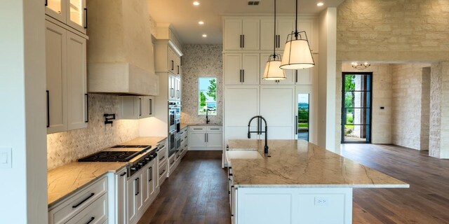 200 E Eldorado Ridge Dr, Fredericksburg, TX 78624 - kitchen with a sink, premium range hood, gas cooktop, healthy amount of natural light, and recessed lighting