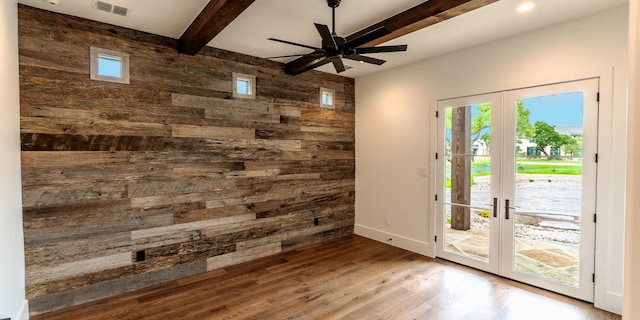 200 E Eldorado Ridge Dr, Fredericksburg, TX 78624 - entryway with french doors, wood walls, a ceiling fan, beam ceiling, and wood finished floors