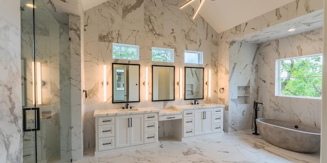 200 E Eldorado Ridge Dr, Fredericksburg, TX 78624 - full bath featuring stone wall, double vanity, a marble finish shower, and a freestanding tub