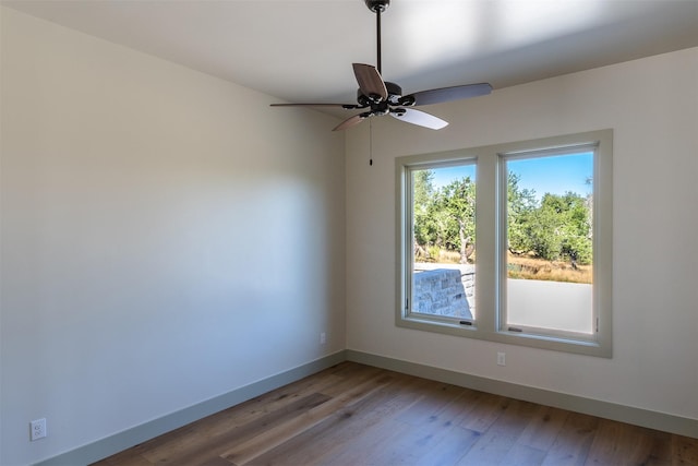 spare room featuring ceiling fan and wood-type flooring