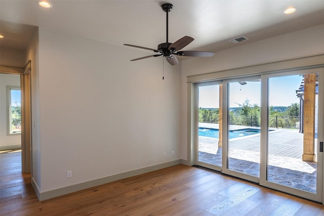 interior space featuring light wood-type flooring and ceiling fan