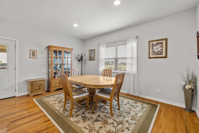 dining area with light hardwood / wood-style flooring