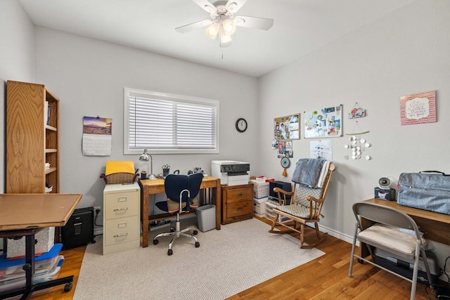 office area with ceiling fan and hardwood / wood-style flooring