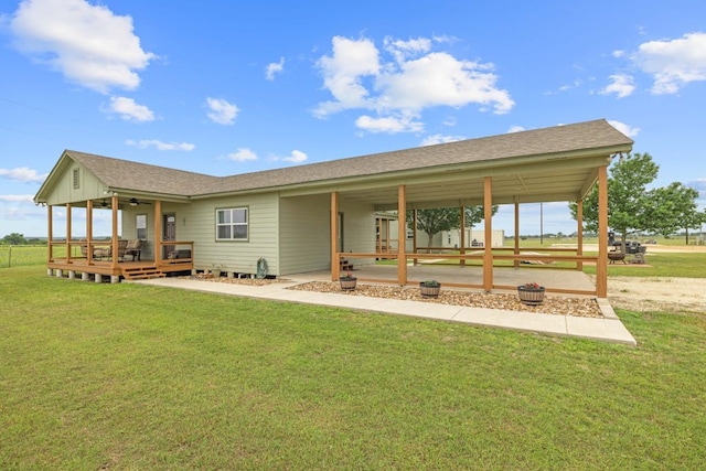 1881 County Road 251, Florence, TX 76527 - rear view of house with a yard, a wooden deck, ceiling fan, and a patio