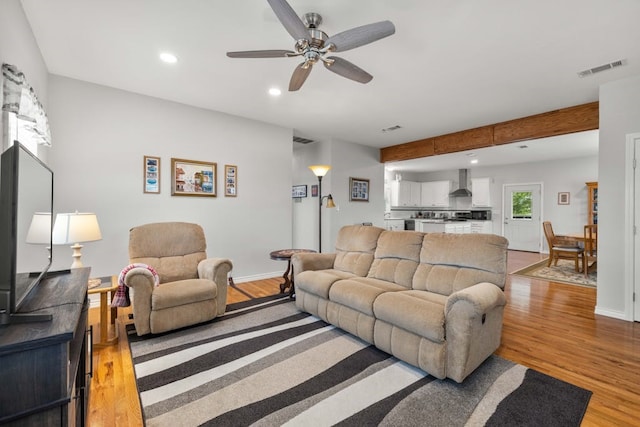 1881 County Road 251, Florence, TX 76527 - living room with a ceiling fan, light wood-type flooring, recessed lighting, and beamed ceiling