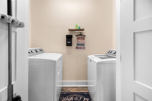 clothes washing area with washer and dryer