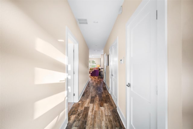 hallway featuring dark hardwood / wood-style floors