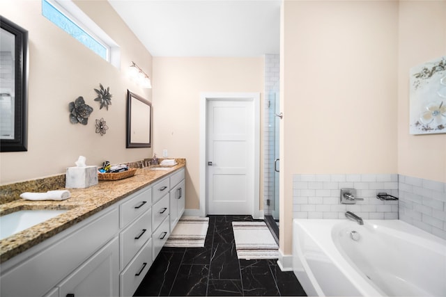 bathroom featuring vanity and independent shower and bath