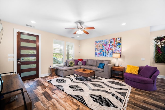 living room with hardwood / wood-style flooring and ceiling fan