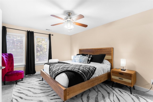 bedroom featuring ceiling fan and light colored carpet