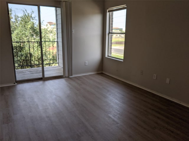 empty room featuring dark hardwood / wood-style flooring