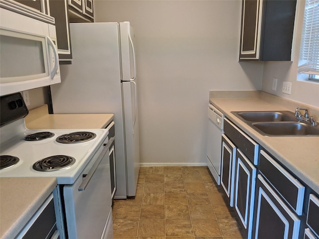 kitchen with sink and white appliances