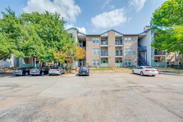 12166 Metric Blvd Unit 341, Austin, TX 78758 - view of property featuring uncovered parking