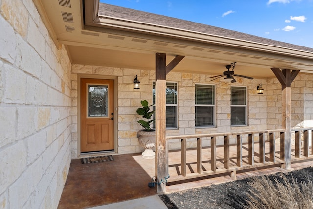 view of exterior entry featuring ceiling fan