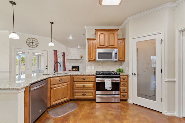 kitchen featuring decorative light fixtures, tasteful backsplash, concrete floors, sink, and appliances with stainless steel finishes