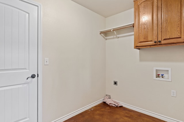 clothes washing area featuring hookup for a washing machine, electric dryer hookup, and cabinets