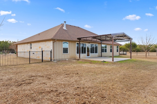 rear view of property with a patio area and a yard