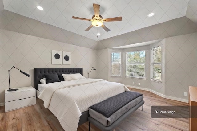 bedroom with ceiling fan and wood-type flooring