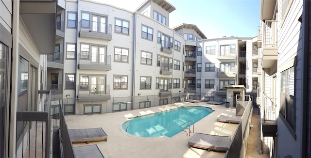 view of swimming pool with a patio