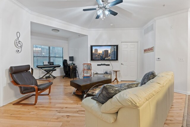 2502 Leon St Unit 211, Austin, TX 78705 - living area featuring light wood-style flooring, ceiling fan, and ornamental molding