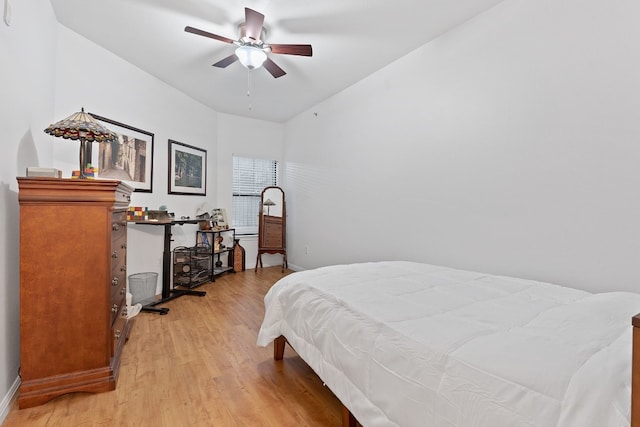 bedroom with ceiling fan and light hardwood / wood-style floors