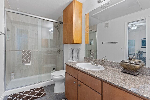2502 Leon St Unit 211, Austin, TX 78705 - bathroom with vanity, a shower stall, tile patterned flooring, and ceiling fan