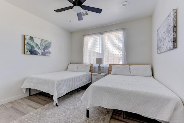 bedroom featuring ceiling fan and hardwood / wood-style floors