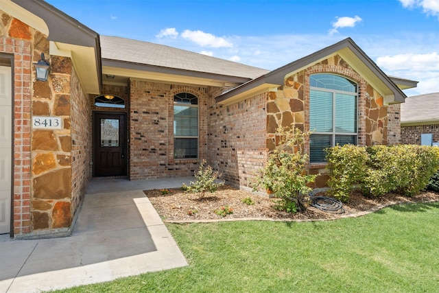 property entrance with a yard