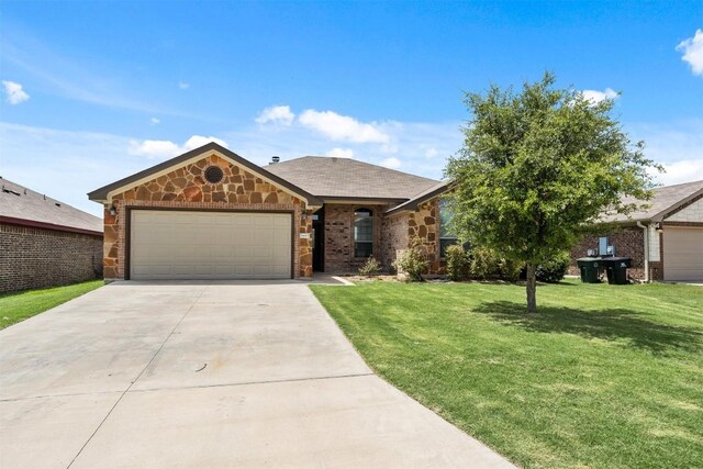 ranch-style home featuring a front lawn and a garage