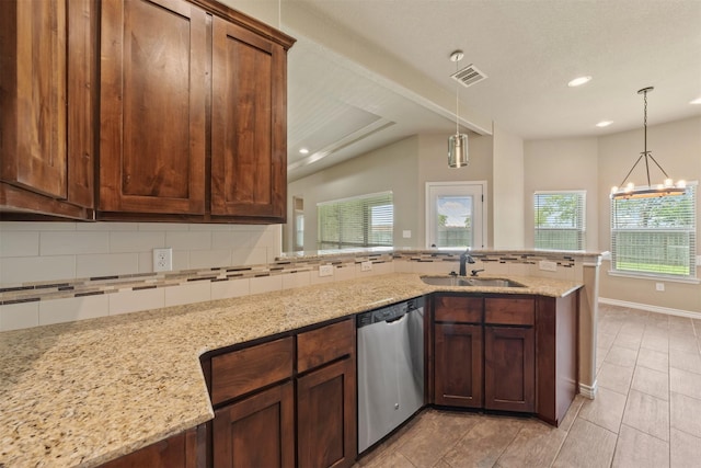 kitchen with decorative backsplash, dishwasher, sink, and light stone counters