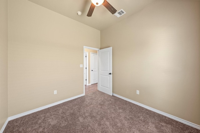 unfurnished bedroom featuring vaulted ceiling, ceiling fan, and carpet flooring