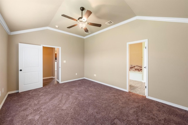 unfurnished bedroom with lofted ceiling, ceiling fan, dark carpet, and ornamental molding