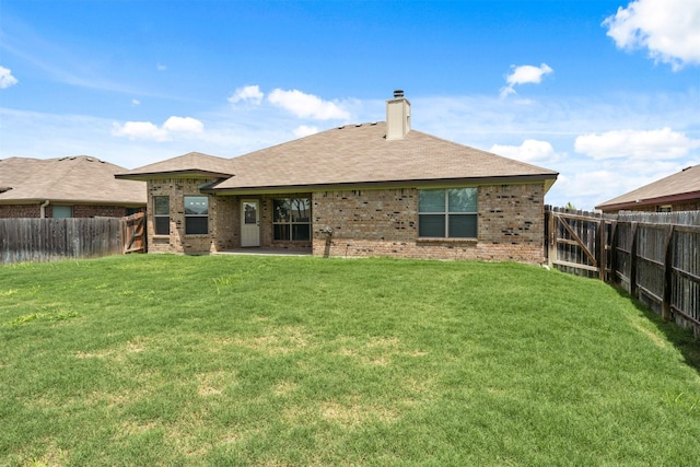 back of house featuring a yard