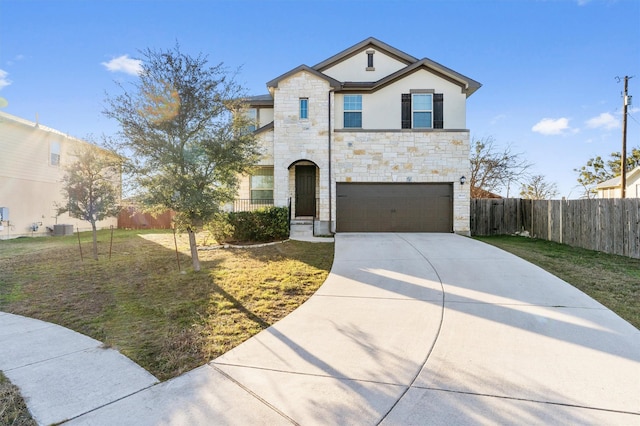 view of front of house featuring a garage, a front lawn, and central AC unit